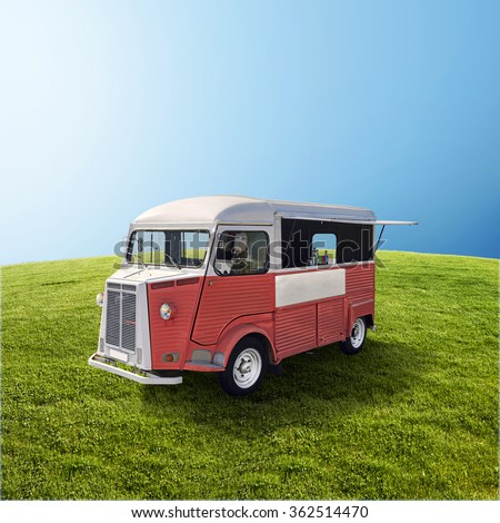 Red retro fast food truck on green field with blue sky, template with copy space Royalty-Free Stock Photo #362514470