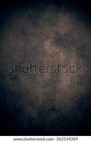 Brown tan black cloth fabric canvas or muslin studio background, darker edges and lighter center, neutral and traditional for portraiture, etc Royalty-Free Stock Photo #362534369