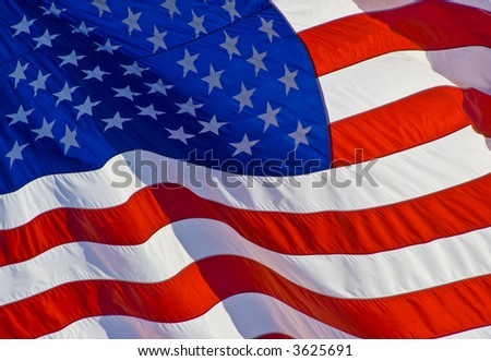 Tilted stars and stripes flying in the wind on nice background for a patriotic display Royalty-Free Stock Photo #3625691