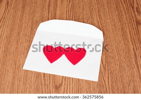 Red heart shape on white envelope. Love symbol