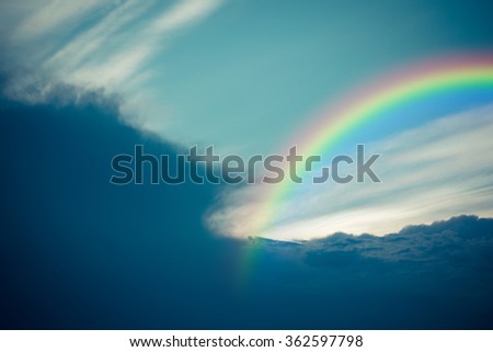 Nature cloudscape with blue sky and white cloud with rainbow , process in vintage style
