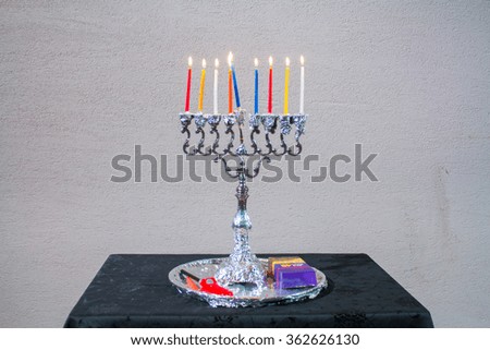 jewish holiday Hanukkah background with menorah Burning candles isolated on black