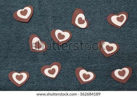 Textile hearts. Romantic love theme on jeans background. Toned.