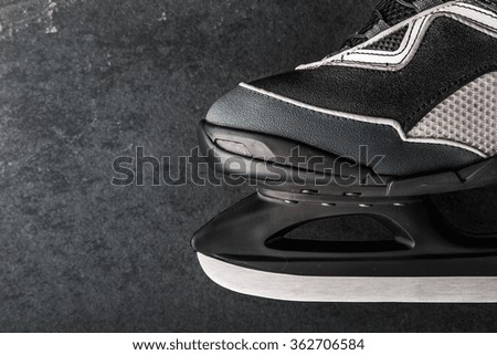 Skates on the dark stone