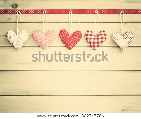 Lovely hearts over wood 