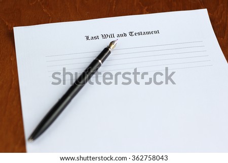 last will and testament on the white paper with pen