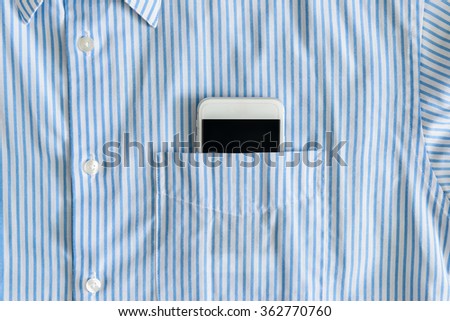 Smartphone with a black screen in a pocket of shirt