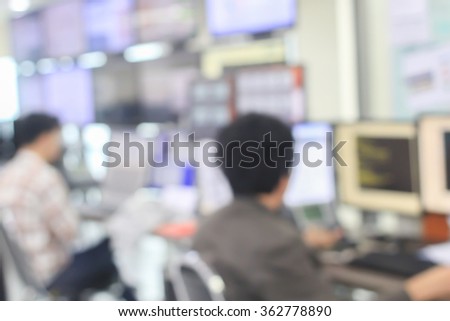 blurred man employee working with display computer monitoring in office room concept.