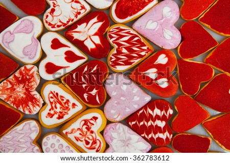 Valentine's day cookies. Heart shaped cookies for valentine's day.Red and Pink Heart Shaped Cookies. Valentine`s Day background. Romantic seamless pattern with cookies hearts.