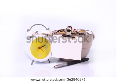 money jar with coins, clock, pen, and paper isolated on white background. finance concept