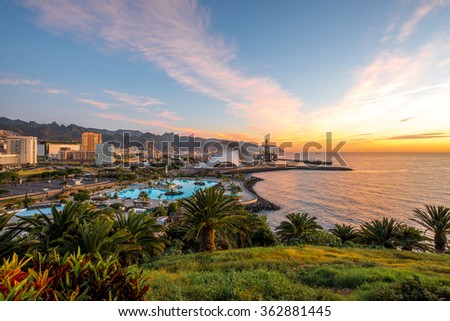 Santa Cruz cityscape view with park, ocean and mountains on the background on the sunrise, Canary islands, Spain  