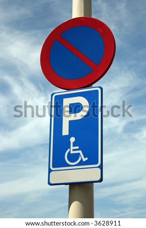Handicap parking sign on a lantern pole