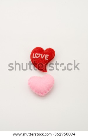 Two red and pink valentine hearts isolated on white