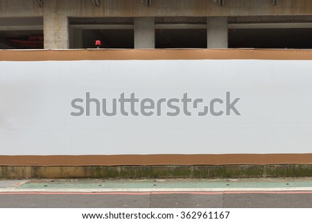Large blank billboard on a street wall, banners with room to add your own tex