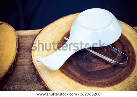   Melamine spoon on  wood cutting board.