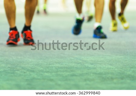 Blurred photo, running marathon vintage style.