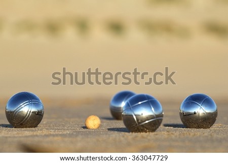 bocce balls on sandy beach Royalty-Free Stock Photo #363047729