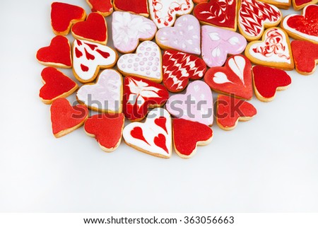 Valentine's day cookies. Heart shaped cookies for valentine's day. Red and Pink Heart Shaped Cookies. Valentine`s Day background. Romantic seamless pattern with cookies hearts.