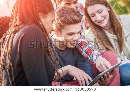 Group of Multiracial Teenage Friends with Tablet PC  - stock