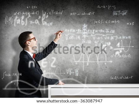 Student drawing science formulas