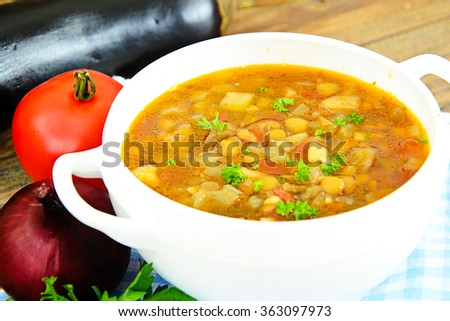 Lentil soup with eggplant, tomatoes and onions. Studio Photo