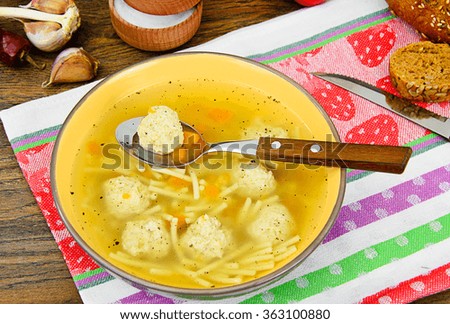 Soup with chicken meatballs and noodles Studio Photo