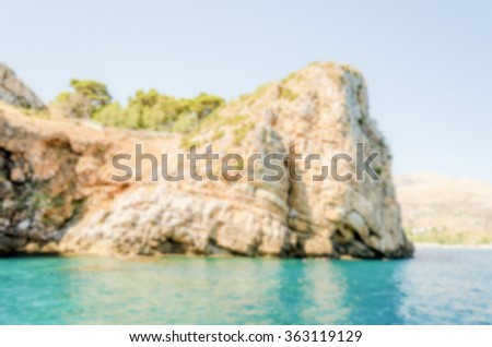 Defocused background with wild coastline of Zingaro Natural Reserve, Sicily. Intentionally blurred post production for bokeh effect