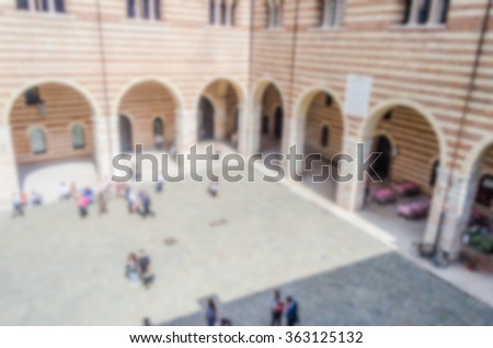 Defocused background with Palazzo del Mercato Vecchio, Verona, Italy. Intentionally blurred post production for bokeh effect