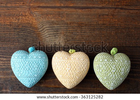 decorative colorful heart on a wooden brown table