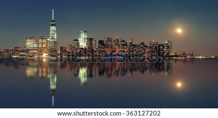 New York City at night with urban architectures reflections