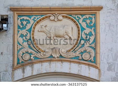 Bas-relief of the Soviet era in the building of the livestock pavilion. Kiev, Ukraine