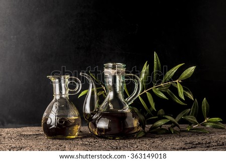  Extra virgin olive oil on rustic background Royalty-Free Stock Photo #363149018