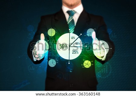 Businessman holding business diagrams, concept of success