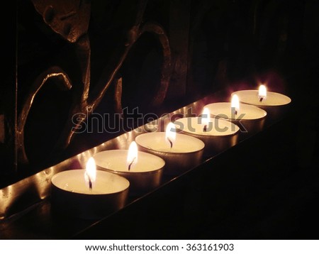 burning candles in the cathedral