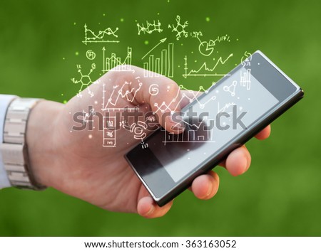 Hand holding smartphone with business scheme on it