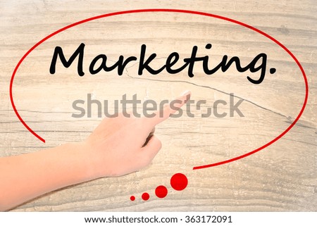Hand writing as "Marketing" to be a notice.
Isolated on office. Business, technology, internet concept.