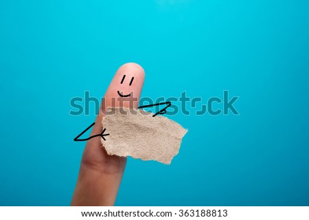 Funny finger holding blank bunner showing on it and smiling