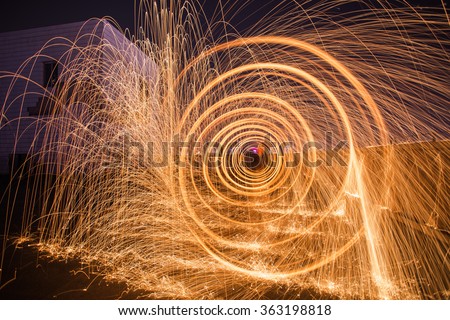 Burning steel wool spinner on the roof top