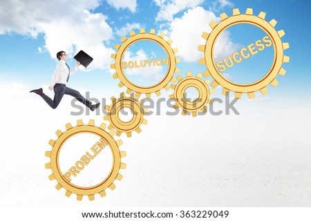 Young businessman with a folder in hand running up six golden gears. Blue sky at the background. Concept of career growth.
