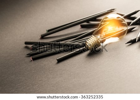 Bulb Light Idea Pencils Paper - Stock Image