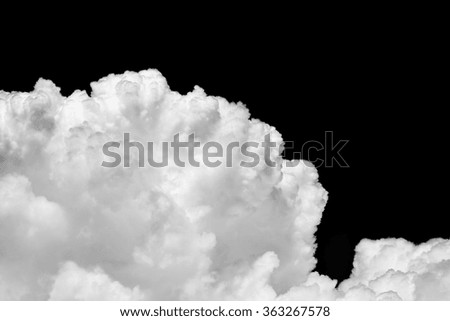 Black and White fluffy clouds in the blue sky