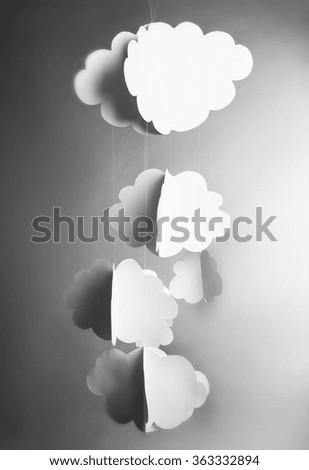 Paper clouds on grey background