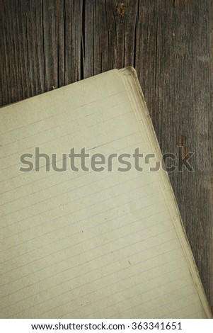 vintage paper with lines for letter on wooden background