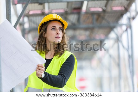 Female construction site engineer Royalty-Free Stock Photo #363384614
