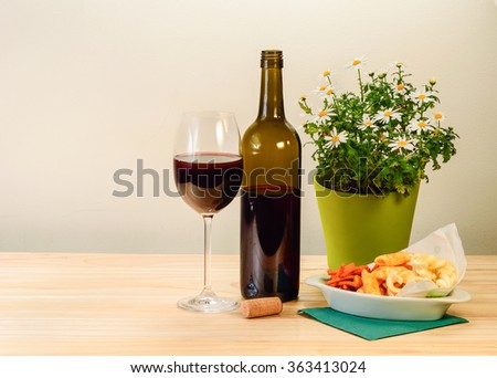 Still life with Bottle red wine with glass of wine on wooden table