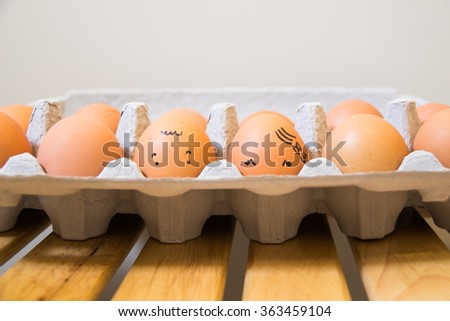 A tray of smile eggs on the table.