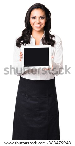 Hispanic waitress in her twenties showing blank digital tablet computer isolated on white background