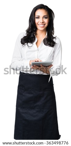 Hispanic waitress in her twenties taking order on digital tablet computer isolated on white background