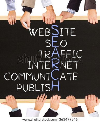 Photo of business hands holding blackboard and writing SEARCH concept
