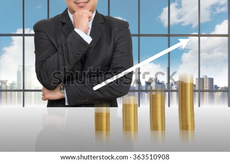 Businessman with gold coins growth up in office conference meeting room on photo blurred cityscape, Business investment growth concept
